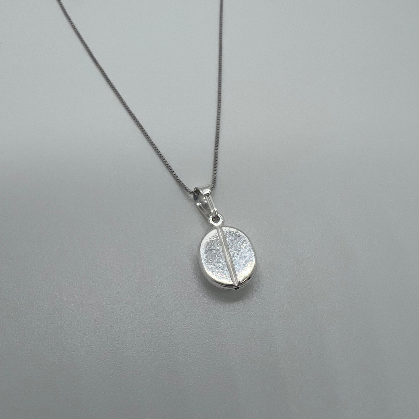 ciondolo chicco di caffè argento