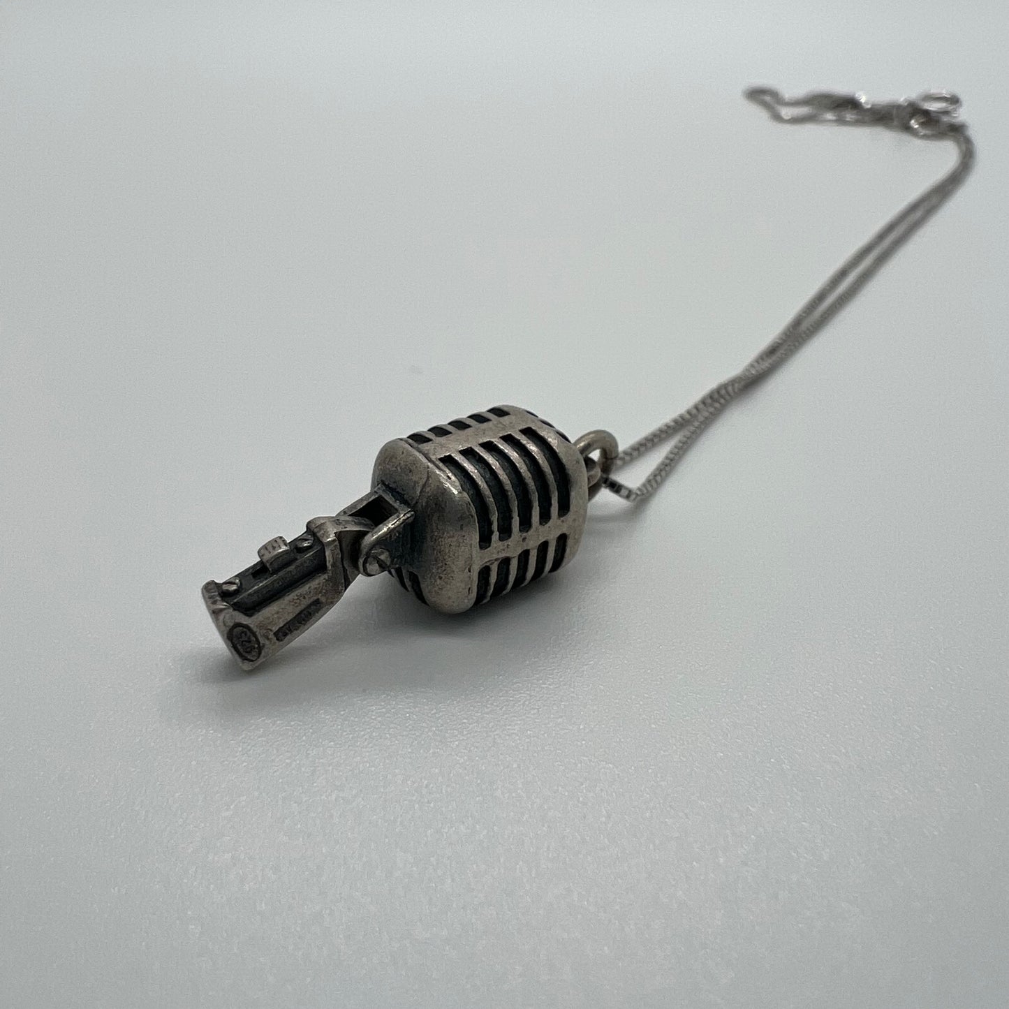 ciondolo microfono anni 80 shure brunito
